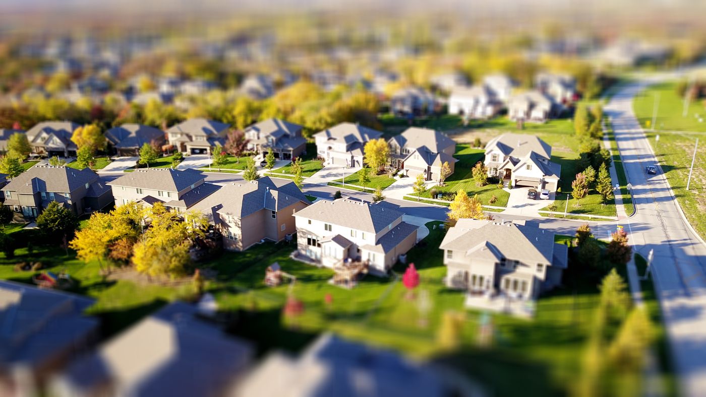 People reviewing real estate documents and development plans